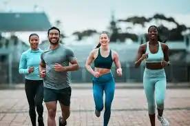 image of man and 3 women doing cardio exercise Weybridge to help tone and remove fat from the body.
